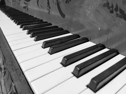 A piano or piano is a stringed percussion and keyboard musical instrument. An octave is a musical interval in which the ratio of frequencies between sounds is one to two. Black and white monochrome.