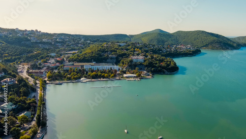 Abrau-Diurso, Krasnodar Krai, Russia. Lake Abrau. Embankment and village. Summer. The text on the embankment translates as the name of the village - Abrau-Diurso, Aerial View