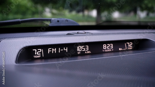 on-board computer screen on the car's dashboard with automatic air conditioning and radio displays
