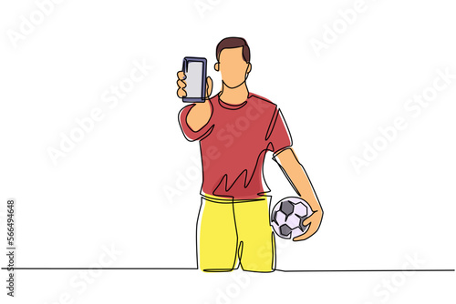 Single continuous line drawing soccer player holding football ball and smartphone. Mobile football soccer. Mobile sport play match. Online soccer game with live mobile app. One line draw design vector