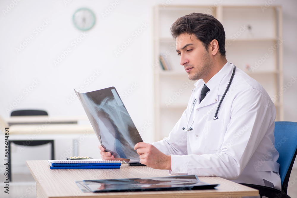 Young male doctor radiologist working in the clinic Young male doctor radiologist working in the clinic