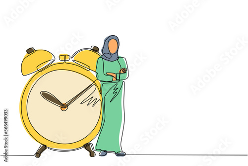 Single one line drawing Arab businesswoman, manager or employee stand leaning to big clock. Concept of time management. Time, watch, limited offer, deadline symbol. Continuous line draw design vector
