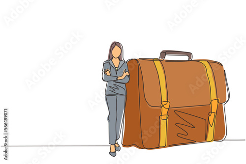 Continuous one line drawing modern confident female entrepreneur leaning on large briefcase. Happy pretty businesswoman standing with elegance pose. Single line draw design vector graphic illustration