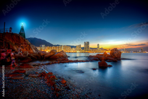 Nightscape, skyline of beach at Sam Ka Tsuen, Lei Yue Mun, Yau Tong with lighthouse and residential buildings, East Kowloon 