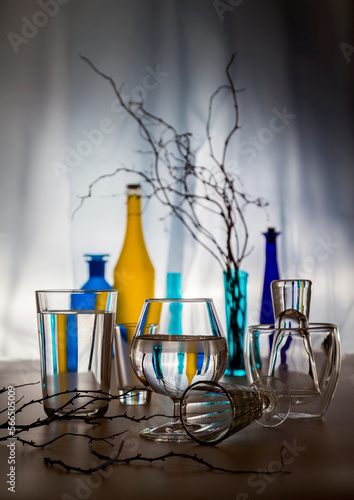 Modern still life with glass bottles and dry branches © 02irina