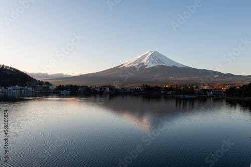 Mount Fuji on a bright winter morning  as seen from across lake Kawaguchi  and the nearby town of Kawaguchiko.
