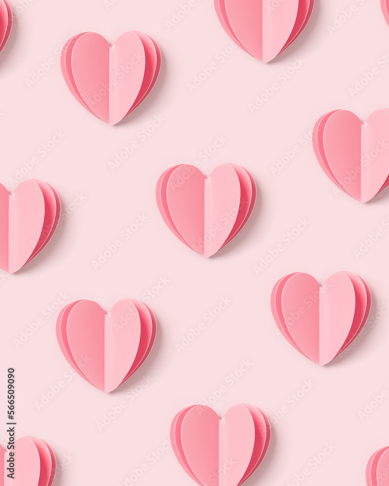 Pink hearts on pink colored background, minimal trend pattern, pastel monochrome color print as valentines day or wedding background. Paper cut hearts, romantic holiday concept, top view