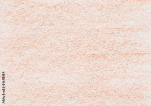 Texture from wax crayon paint in orange color on a white sheet of paper