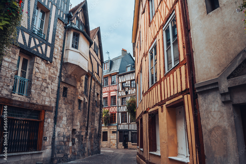 Pretty curved street in the old town of Rouen in Normandy, France with its half-timbered houses.