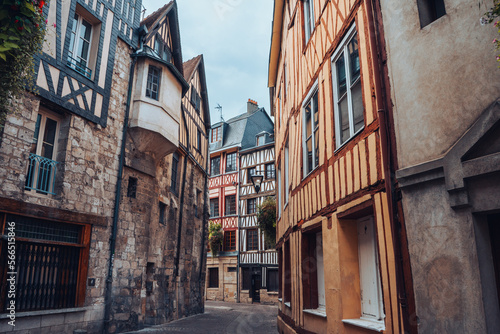 Pretty curved street in the old town of Rouen in Normandy  France with its half-timbered houses.