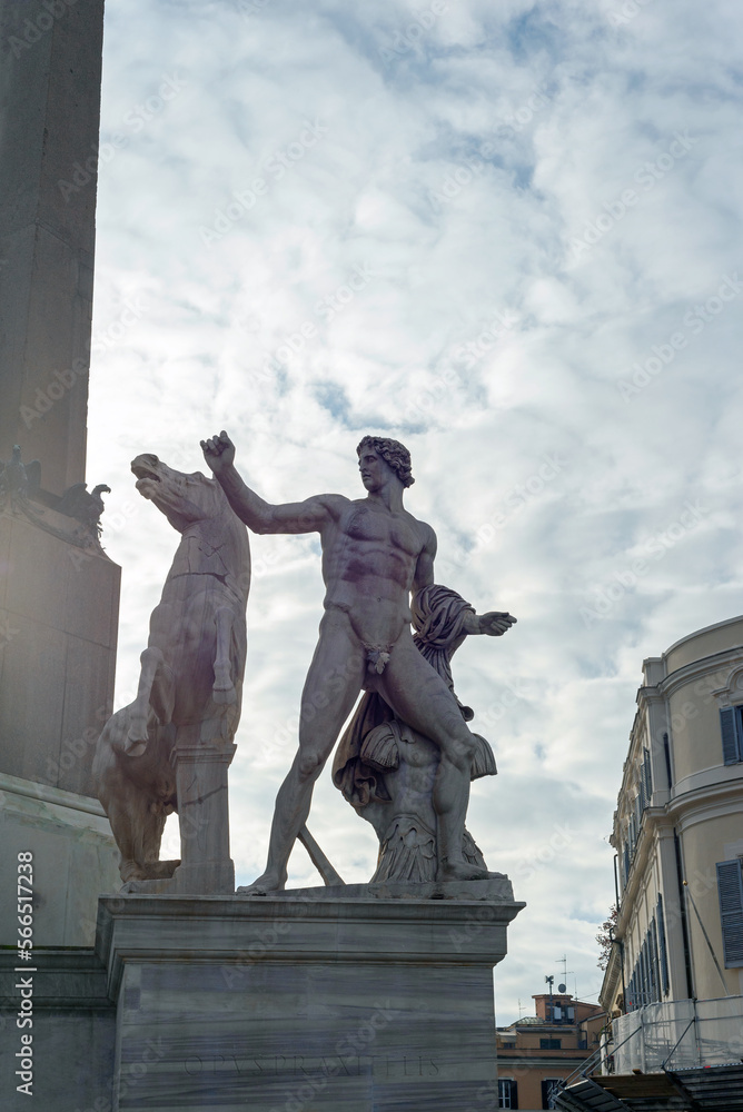 Urban landscape in Rome. Statue , monument, against a background of clouds and sky.