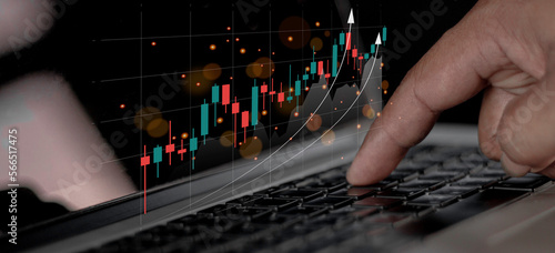 Planning and strategy stock business growth progress or success idea. Businessman or trader’s hand showing graph of browning hologram stock on virtual screen