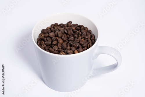 mug full of coffee beans top view - horizontal photo