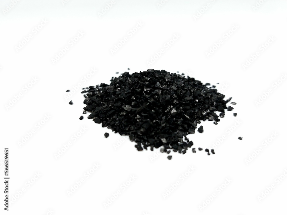 Coconut charcoal activated carbon powder pellets for water purification filter treatment, pile isolated on white background Coconut charcoal activated carbon powder pellets for water purification filter treatment, pile isolated on white background