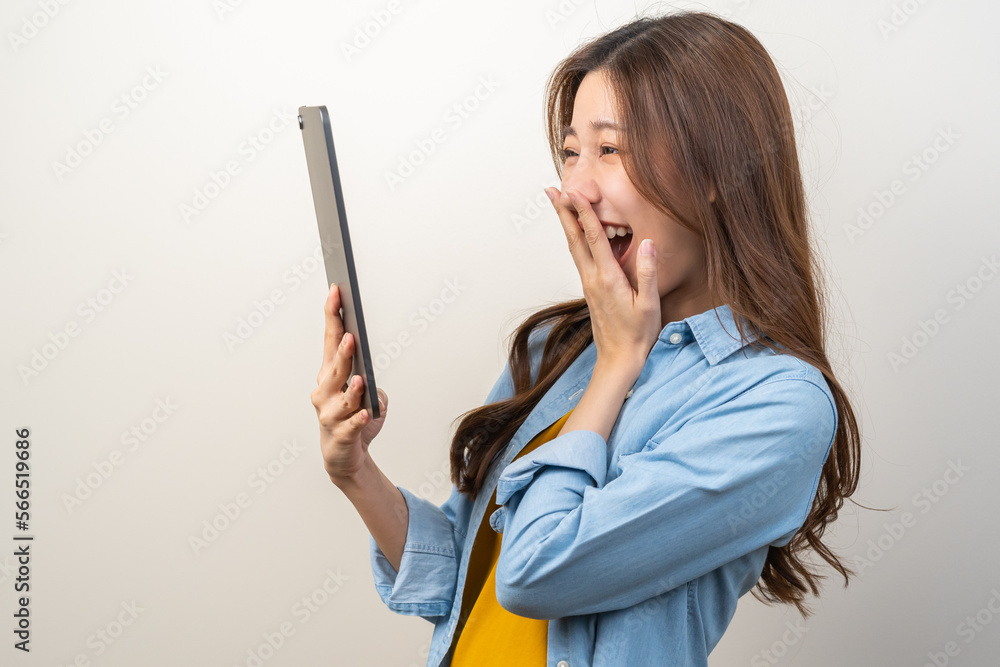Portrait of face expression smile charming brunette, happy asian young woman, girl hand holding tablet, touchpad looking on screen, application in social network online on communication of technology. Portrait of face expression smile charming brunette, happy asian young woman, girl hand holding tablet, touchpad looking on screen, application in social network online on communication of technology.