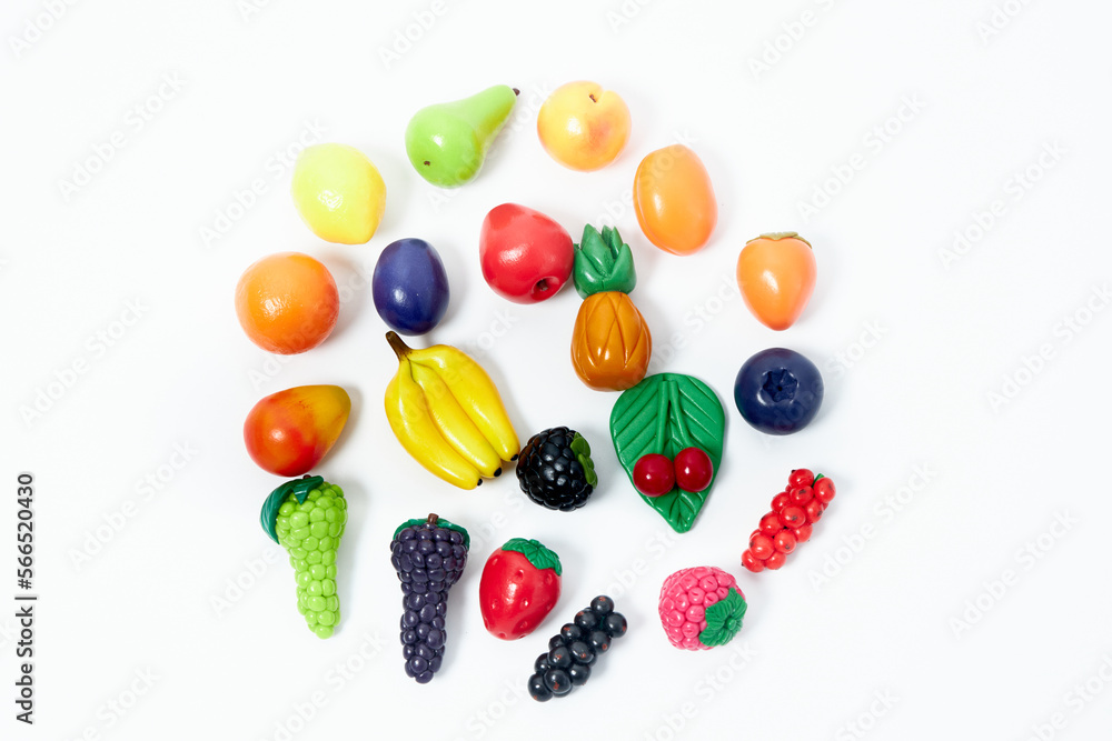 Children's toys in the form of handmade vegetables. On a white background. Children's toys in the form of handmade vegetables. On a white background.