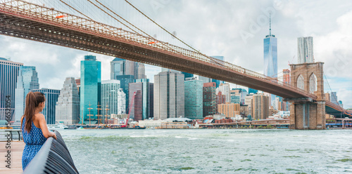 Canvas Print New York City woman looking at view of downtown Manhattan skyline from Brooklyn park living New York lifestyle walking during summer in USA