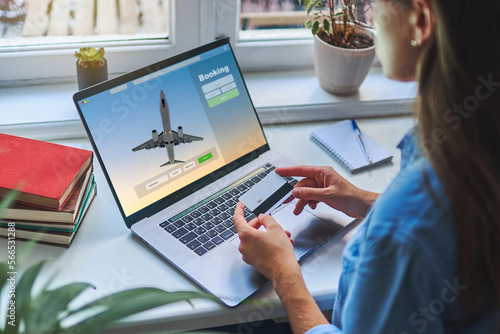 Online booking and buying plane tickets using computer and credit card
