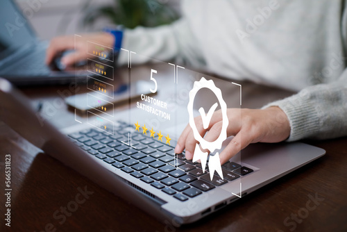Quality assurance of business services, Woman using laptop with sign of the top service Quality assurance in Black background , Guarantee, Standards, ISO certification and standardization concept.