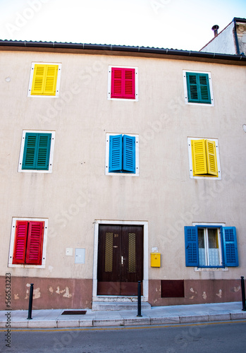 Obraz na płótnie An interesting house with colored shutters. w salonie