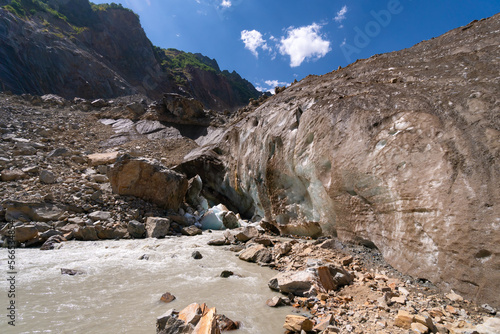 Close-up of Chalaadi glacier with turquoise ice and water on a sunny bright day, Mestia, Georgia photo