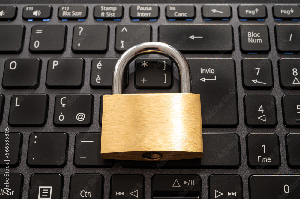 Closed padlock, placed above a pc keyboard. Protection of personal and sensitive data. Privacy. Closed padlock, placed above a pc keyboard. Protection of personal and sensitive data. Privacy.