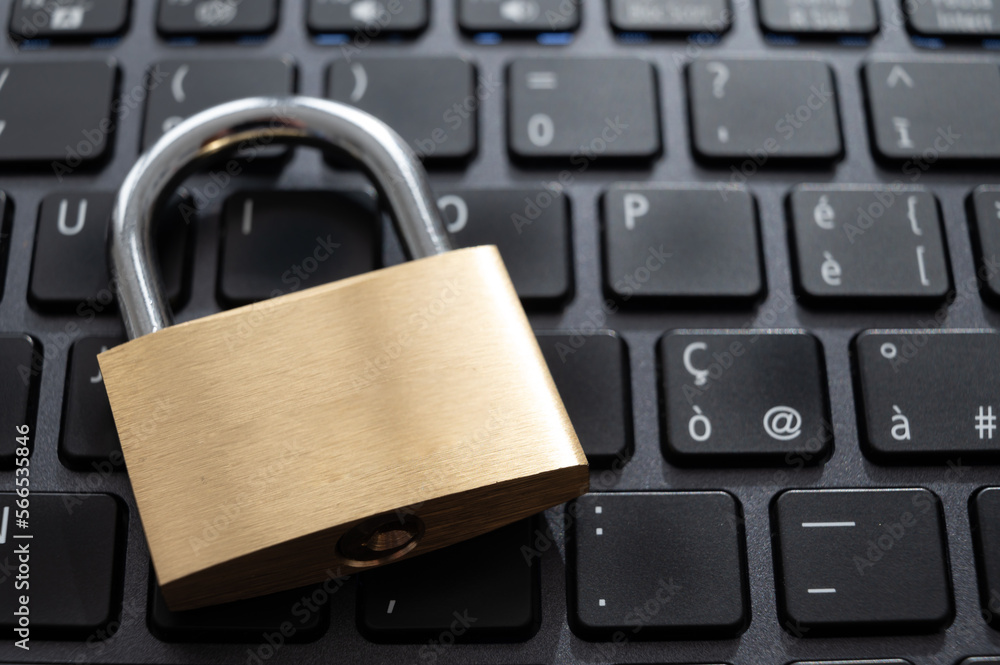 Closed padlock, placed above a pc keyboard. Protection of personal and sensitive data. Privacy. Closed padlock, placed above a pc keyboard. Protection of personal and sensitive data. Privacy.