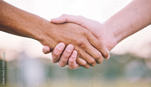 Closeup, handshake and support for sports, agreement and competition with collaboration, goal and target. Zoom, shaking hands or friends with solidarity, community or outdoor for match or partnership