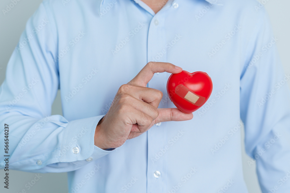 man hand holding red heart shape. love, donor, world heart day, world health day and Insurance concepts man hand holding red heart shape. love, donor, world heart day, world health day and Insurance concepts