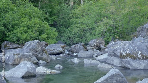 Boulders On A Flowing River In Tropical Forest. Static Shot photo