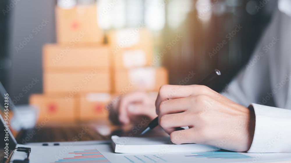 Fototapeta premium Startup or small business entrepreneur,Make a note of the delivery address from the customer,order management in online stores, shopping on the internet,Selling online on the Internet,SME,e-commerce