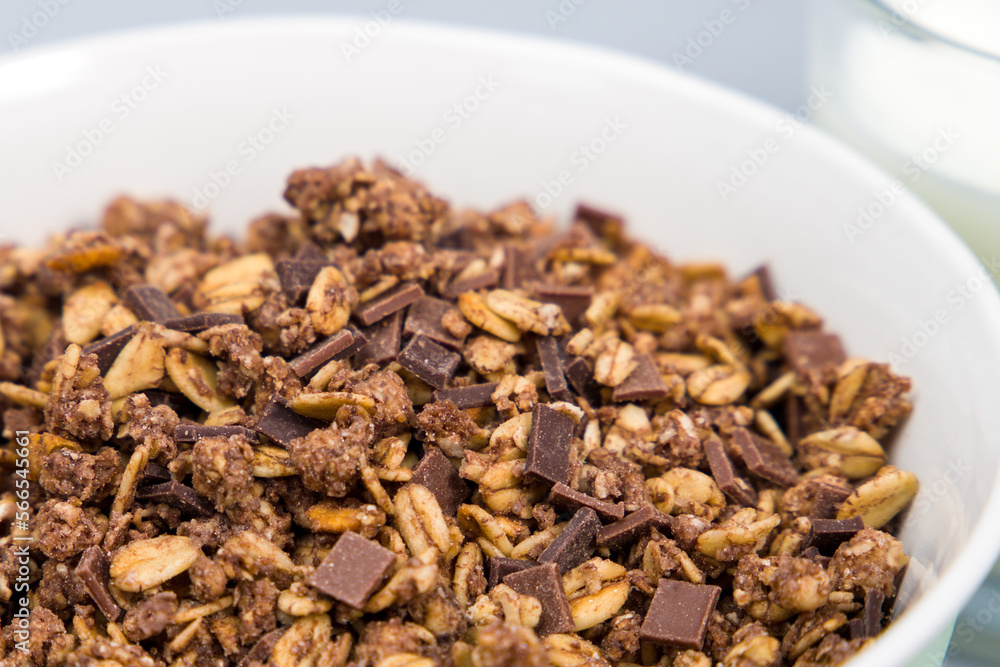 Chocolate granola, crispy muesli in a bowl. Selective focus. Chocolate granola, crispy muesli in a bowl. Selective focus.