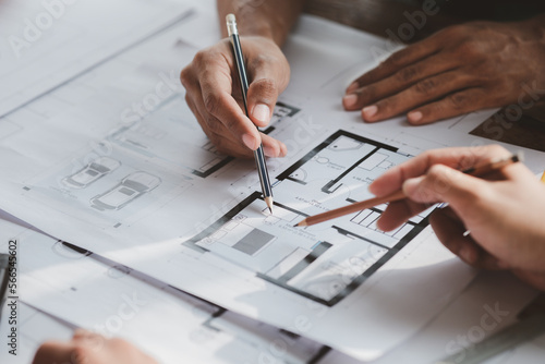 Architects and engineers are working together to edit the draft house plan that was designed after it was presented to the client and partially revised the design. Interior design and decoration ideas