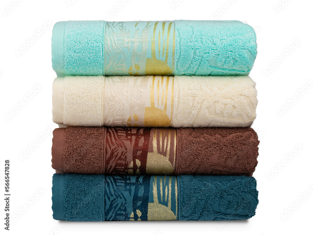 multicolored terry towels, rolled up and stacked on the table multicolored terry towels, rolled up and stacked on the table