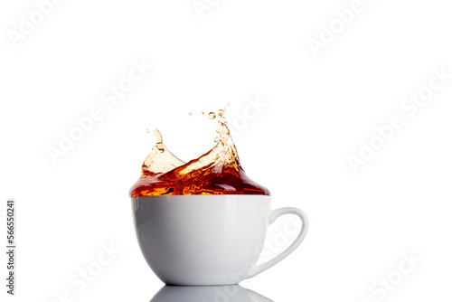 Close up image with cup of tea with splashes.