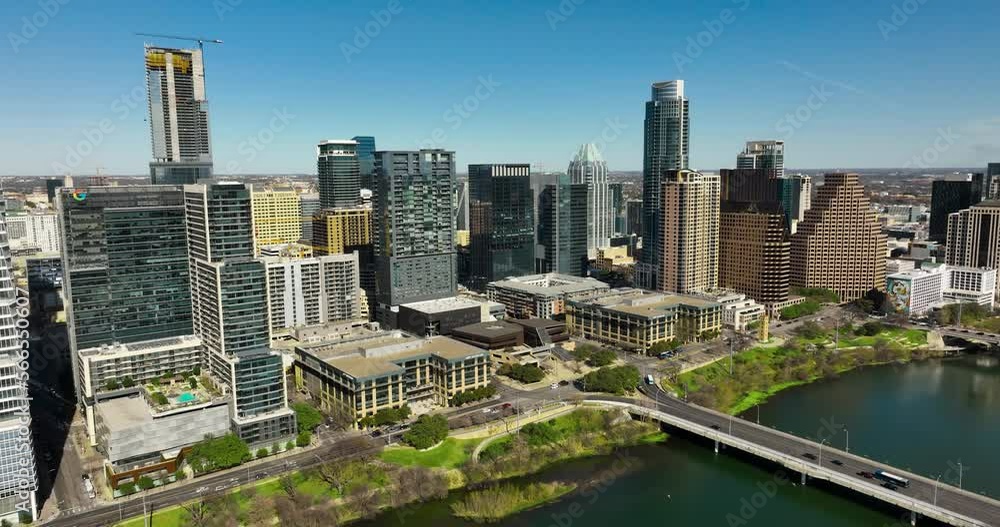 Aerial shot of downtown Austin, TX with the Colorado River in frame Aerial shot of downtown Austin, TX with the Colorado River in frame