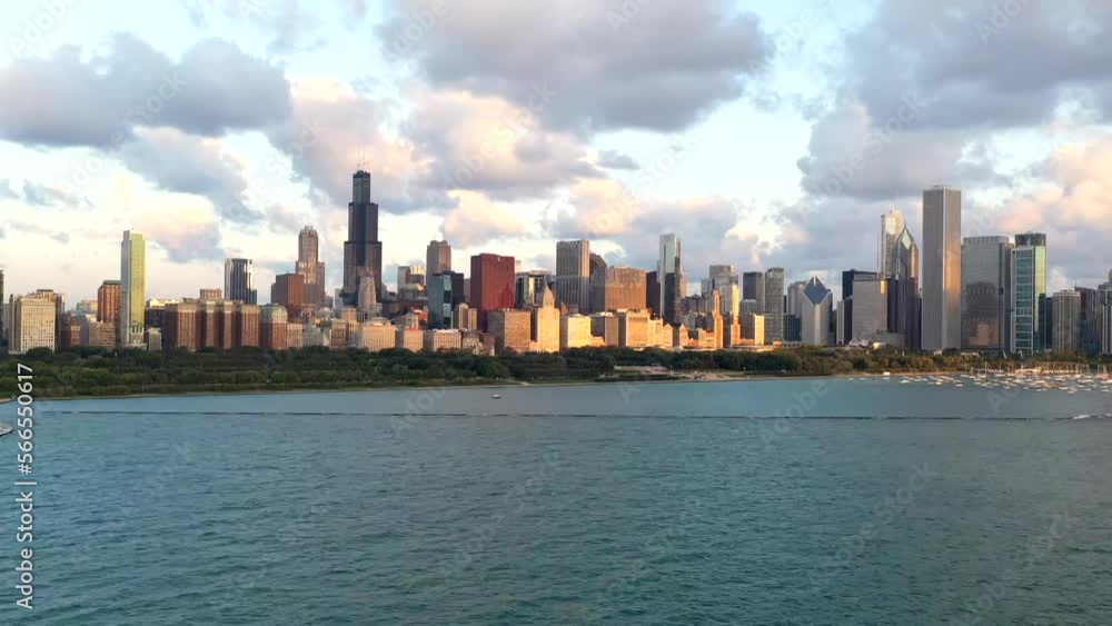 Wide drone hyperlapse of the chicago skyline during golden hour with clouds and lake michigan Wide drone hyperlapse of the chicago skyline during golden hour with clouds and lake michigan