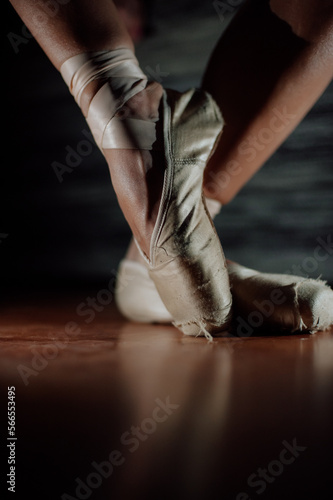 Ballerina. Legs of a ballerina on pointe shoes close-up on a background. Classic and modern. pointe shoes © Виктория