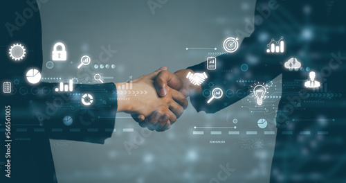 Business and Technology. Businessman and Businesswoman shake hands blurred background, white digital and interface icon.
 photo