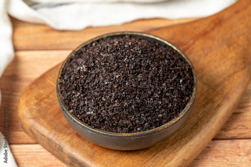 Black hot pepper spice in bowl. Chili pepper is a hot spice obtained by drying the pepper in the sun. Dry spice concept. local name isot. close up Black hot pepper spice in bowl. Chili pepper is a hot spice obtained by drying the pepper in the sun. Dry spice concept. local name isot. close up
