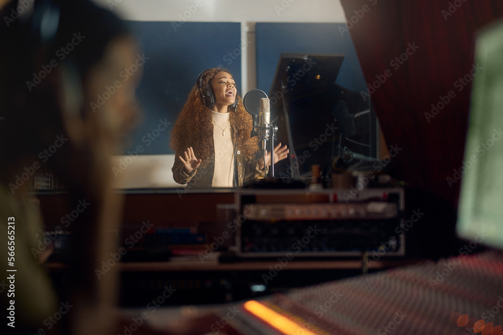 Musician, singing or studio recording microphone in album, audio or radio music cover in night production. Singer, artist or woman in evening song, media or sound performance practice for pop track Musician, singing or studio recording microphone in album, audio or radio music cover in night production. Singer, artist or woman in evening song, media or sound performance practice for pop track