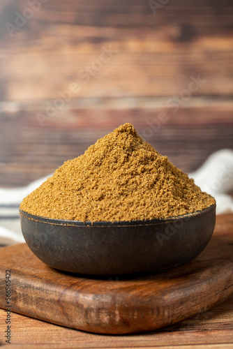 Powdered cumin spice. Cumin spice in bowl on wooden background. Dry spice concept. close up