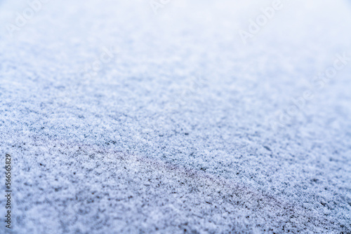 Surface covered with a layer of ice with a shallow depth of field