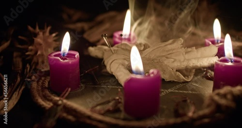 A voodoo ritual with a scary doll. Close-up shot.
