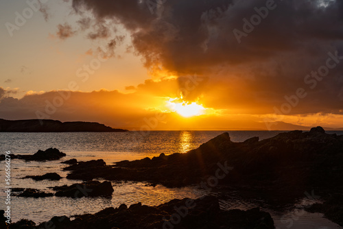 Sunrise from rhoscolyn Beach looking to Snowdonia © Gail Johnson