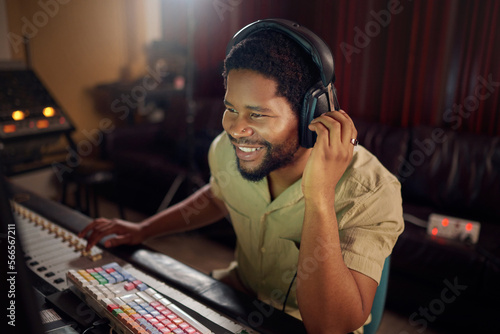 Bilde på lerret Headphones, recording studio and man music producer working a album, song or audio with equipment