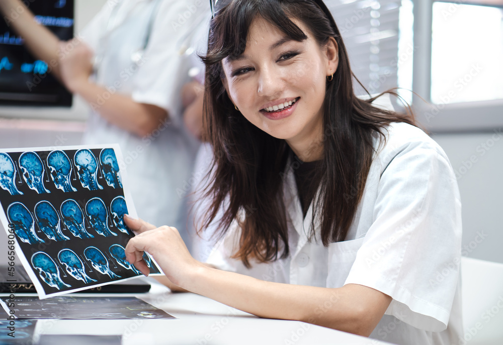 Beautiful female doctor meeting explaining medical xray then diagnosis