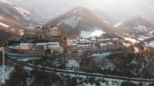 Italy  January 2023  aerial view of the medieval village of Frontone covered in snow. The village is located in the Marche region n the province of Pesaro and Urbino