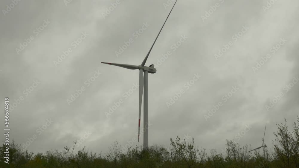 Wind generator with slowly rotating blades on a bush. Wind generator with slowly rotating blades on a bush.