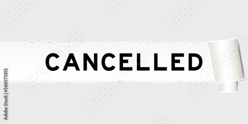Ripped gray paper background that have word cancelled under torn part